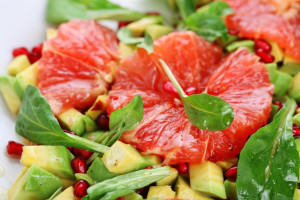 Fresh salad with grapefruit, avocado and pomegranate seeds